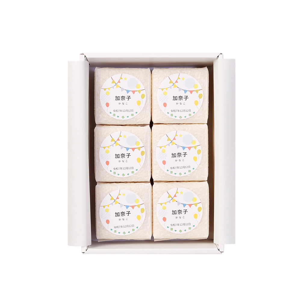 名入れは2合キューブ米の専用ラベルに印字し、主張しすぎない上品なデザインで仕上げています。